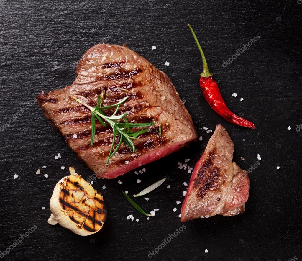 Grilled beef steak with rosemary Stock Photo by ©karandaev 91815684