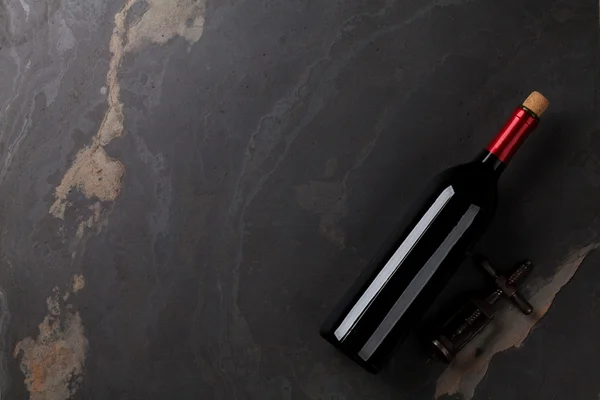 Wine bottle, glass and corkscrew — Stock Photo, Image