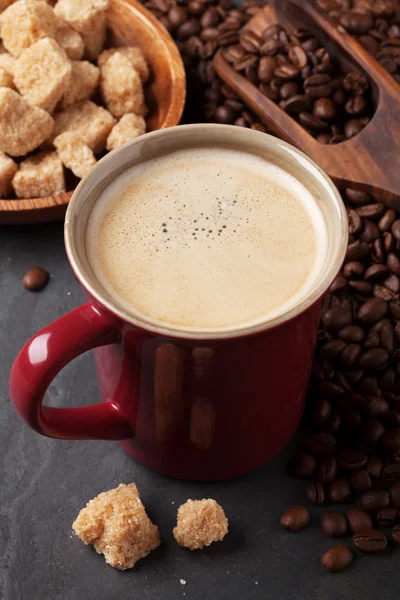 Coffee cup, beans and brown sugar — Stock Photo, Image