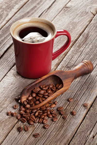 Kaffeetasse und Bohnen — Stockfoto