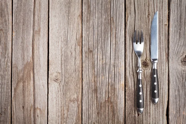 Silverware on wooden table — Stock Photo, Image