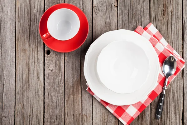 Empty plate, cup and spoon — Stock Photo, Image