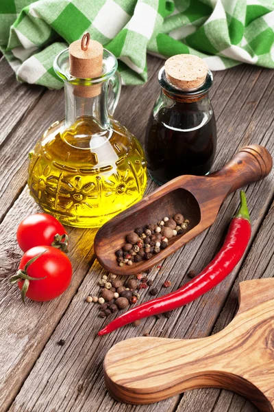 Spices and condiments on wooden table — Stock Photo, Image