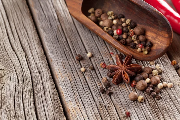 Spices on wooden table — Stock Photo, Image