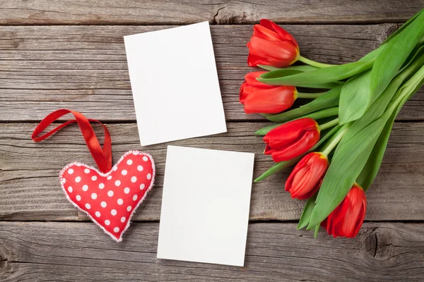 Red tulips, photo frames and heart — Stock Photo, Image