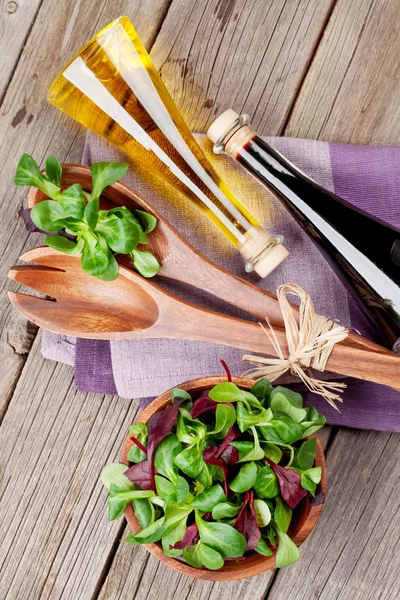 Corn salad leaves and condiments. — Stock Photo, Image