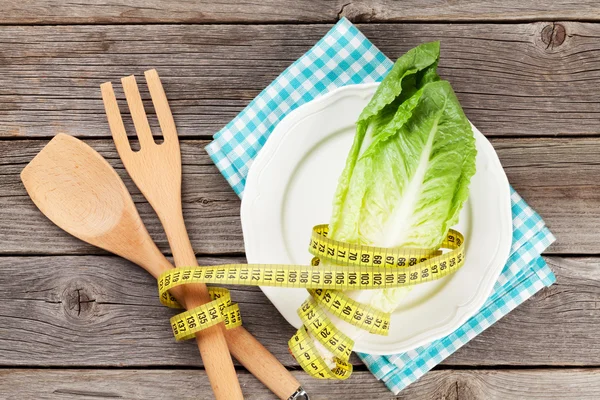 Cabbage and kitchen utensils with  tape measure — Stock Photo, Image