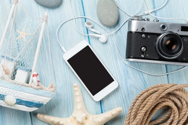 Phone, camera and maritime decorations