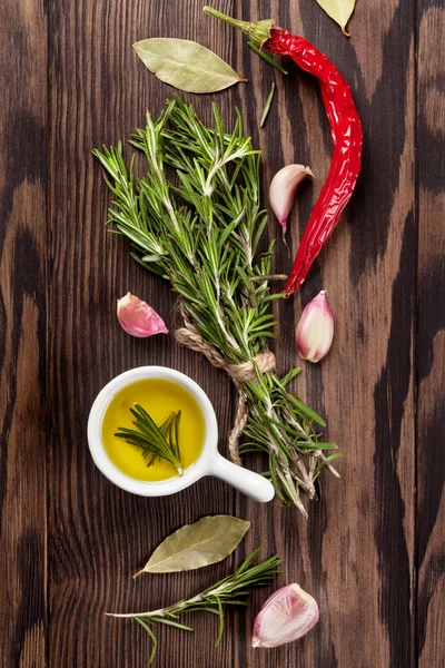 Herbs and spices over wood background — Stock Photo, Image