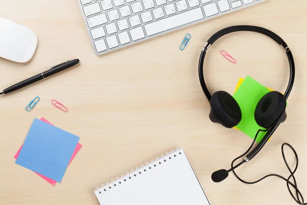 Office desk with headset. — Stock Photo, Image