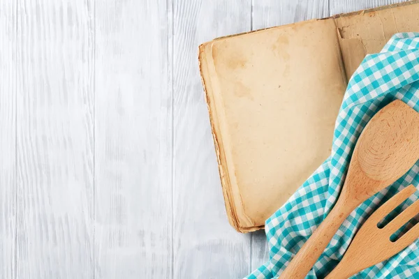 Kitchen table with recipe book — Stock Photo, Image