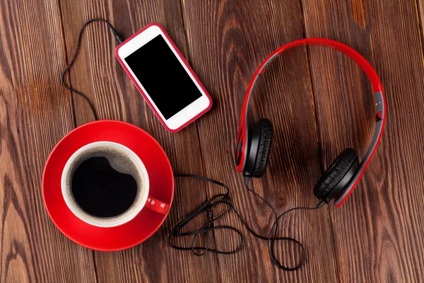 Smartphone, headphones and coffee cup — Stock Photo, Image