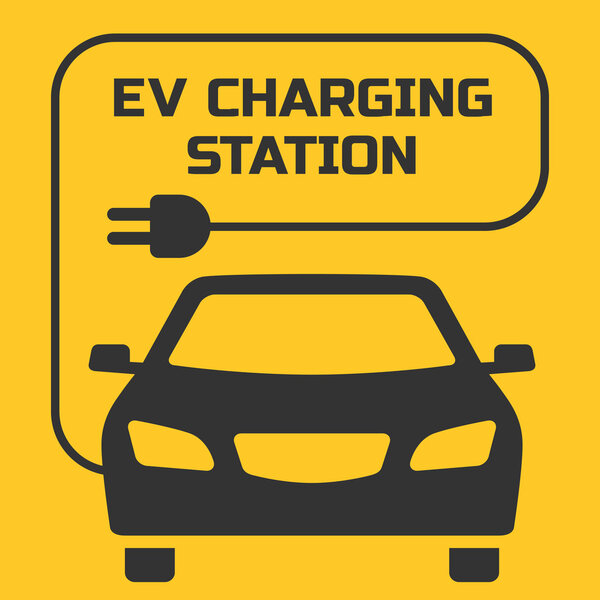 Вывеска EV Charging Station на желтом фоне
