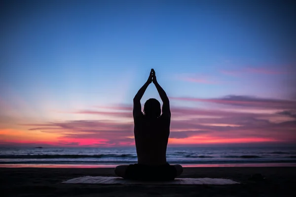 Man silhouette doing yoga exercise — Stock Photo, Image