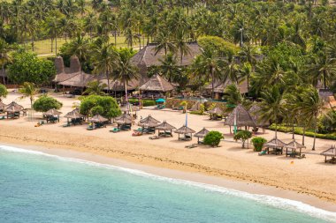 Tropical resort on Kuta sand beach  clipart
