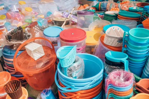 Cheap plastic household items for sale on the market close-up — Foto de Stock