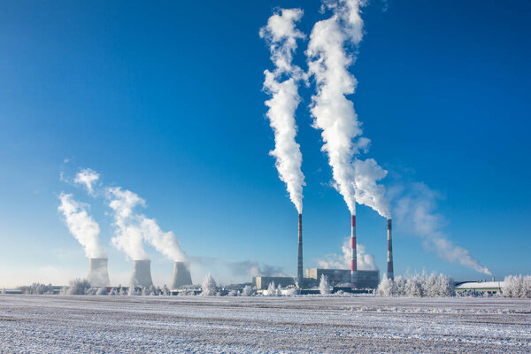 Thermal power station with smoking pipes in winter