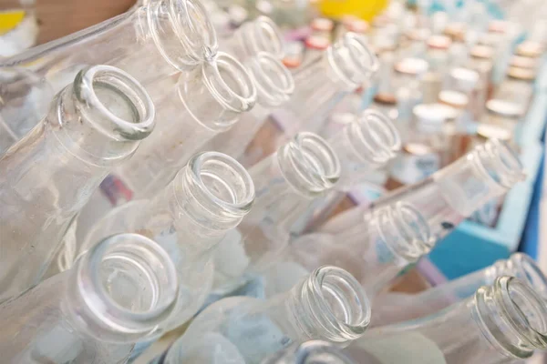 Empty glass bottles collected for recycling close-up — Stock Photo, Image