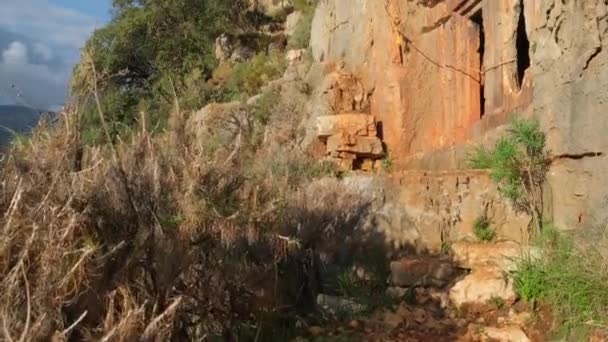 Ancient rock-cut Lycian tombs on a Lycian way trekking route in Turkey — Stock Video