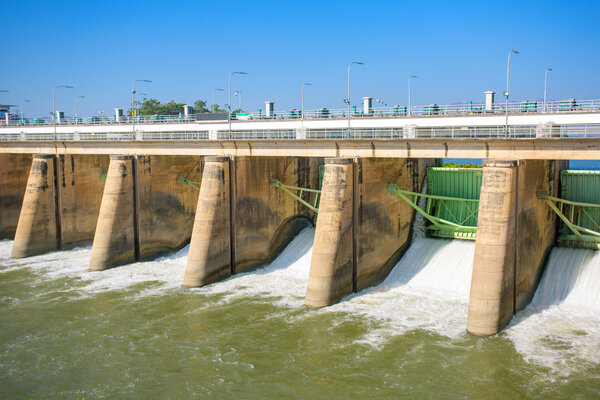 Water rushing through gates at a dam