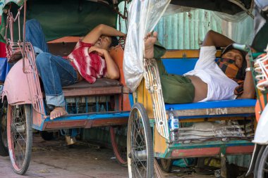 Trishaws resting in wheelchairs