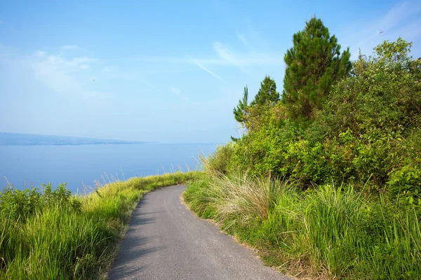 Mountain road and Lake Toba — стокове фото