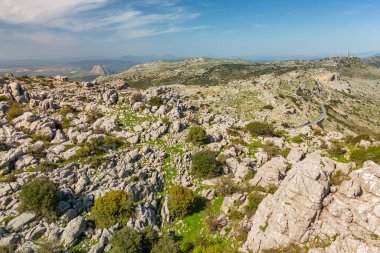 Karst landscape in the Torcal de Antequera nature reserve in the Sierra del Torcal mountain range, Andalusia, Spain. Aerial drone view of the landscape with unusual rock formations