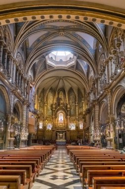 Montserrat, Spain - April 2, 2024: Interior and decoration of Basilica in Benedictine Abbey of Santa Maria de Montserrat in Catalonia, Spain