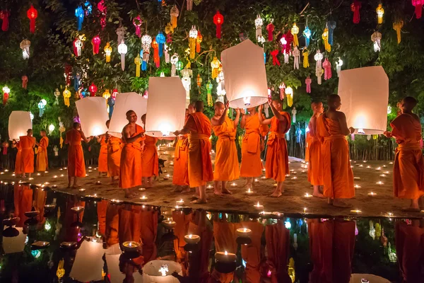 Buddhist monks with candles — Stock Photo, Image