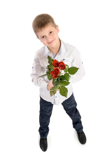 Niño con una rosa aislada sobre fondo blanco — Foto de Stock