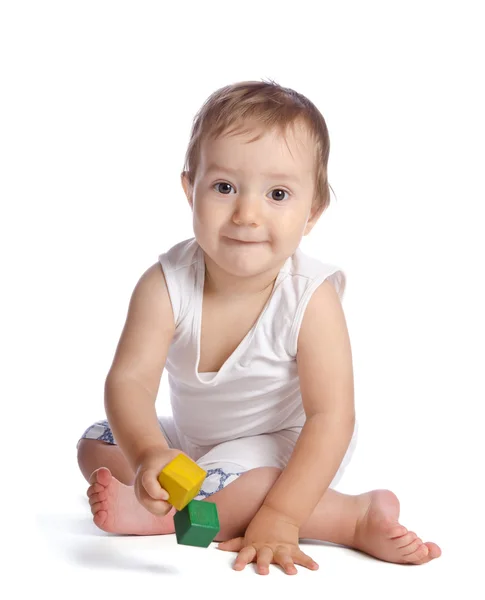 Lustiges Baby mit Würfeln auf weißem Hintergrund — Stockfoto