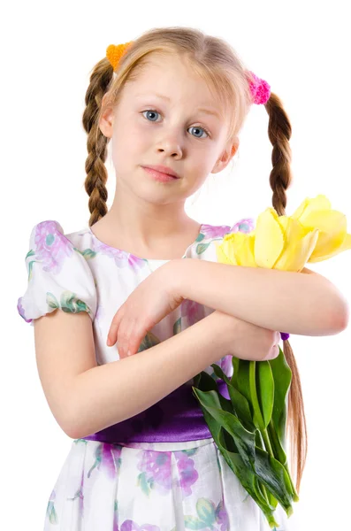 Little girl holding yellow tulips isolated on white — Stock Photo, Image