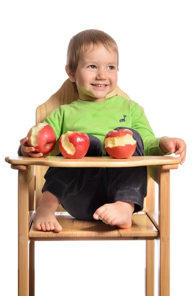 Lindo niño con manzanas rojas sobre fondo blanco —  Fotos de Stock