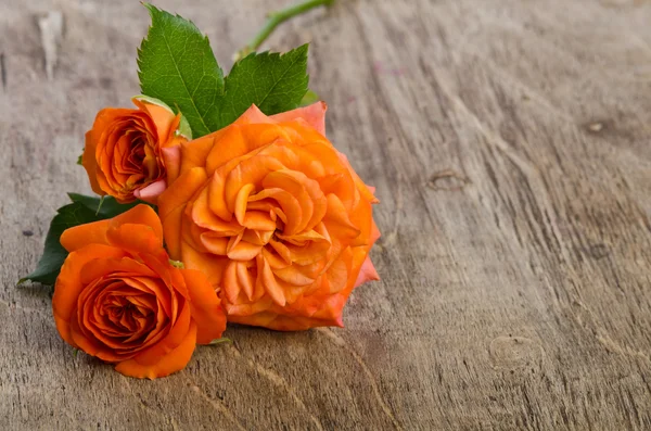 Roses on wooden background — Stock Photo, Image