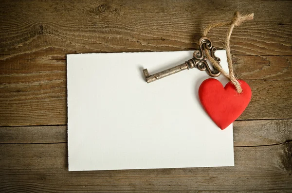 Handmade Heart with key together lying on the paper for message — Stock Photo, Image