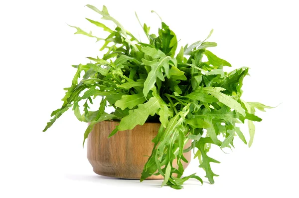 Fresh arugula beam in wooden salad bowl — Stock Photo, Image