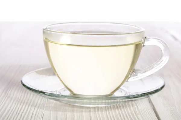 Šálek čaje na bílý dřevěný stůl — Stock fotografie