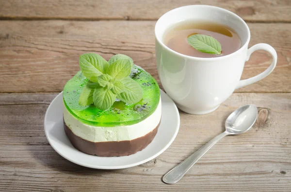 Herbal tea with cake on wooden background. — Stock Photo, Image