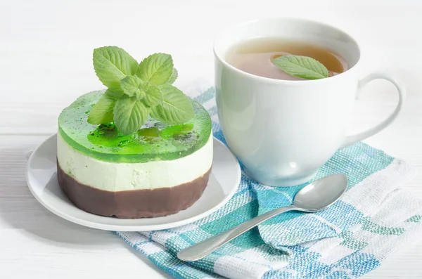 Herbal tea with cake on white wooden table — Stock Photo, Image