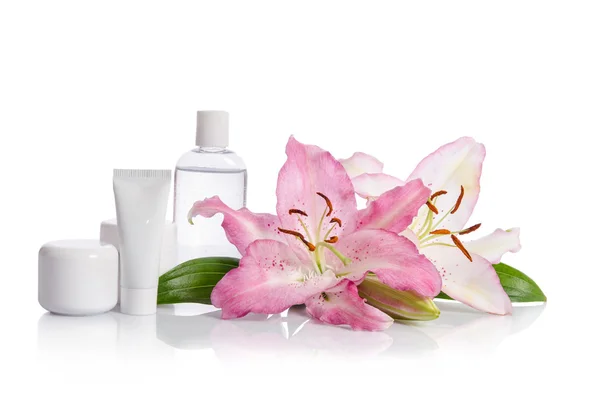 Cosmetic set for skin care on a white background with flowers li — Stock Photo, Image