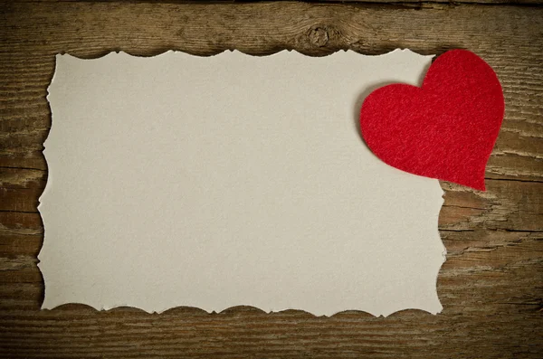 The form for a card on wooden background . handmade heart from r Stock Photo