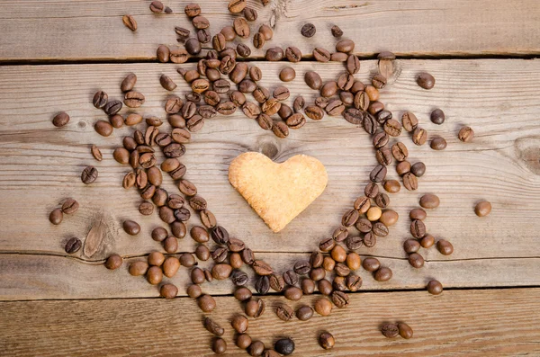 Frame- heart from coffee beans and cookies-heart  inside it on