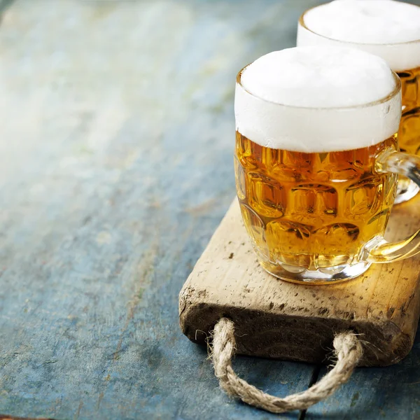 Beer on wood background with copyspace — Stock Photo, Image