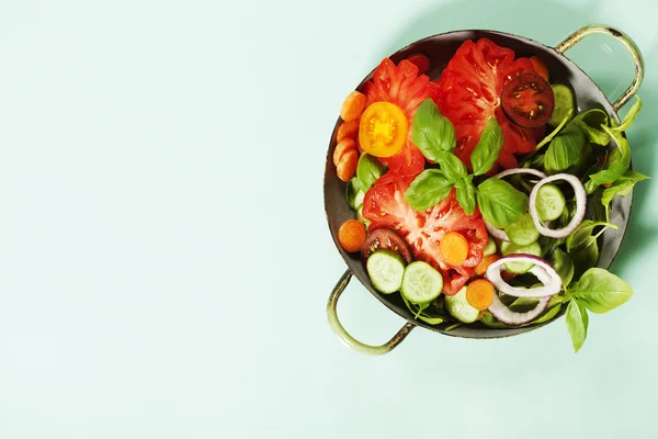 Fresh salad on blue background — Stock Photo, Image