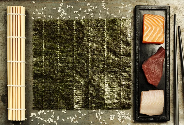 Assortment of raw fish and ingredients for making sushi — Stock Photo, Image