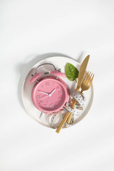 Composition with cutlery, measuring tape and alarm clock on white background. Diet concept — Stock Photo, Image