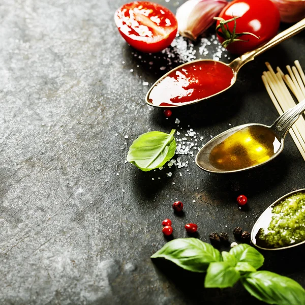 Tomato sauce, olive oil, pesto and pasta — Stock Photo, Image