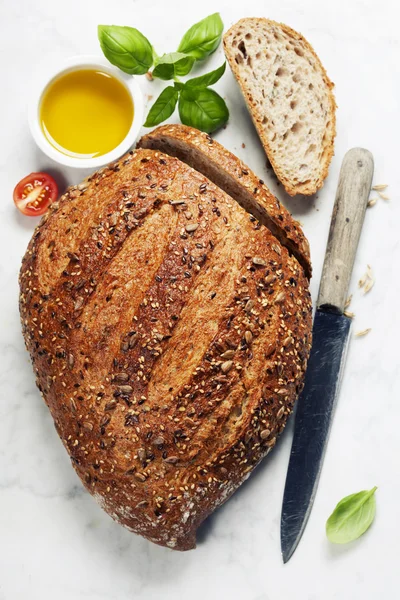 Loaf of fresh bread and ingredients for making sandwich — Stock Photo, Image