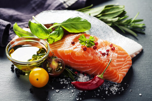 Delicious  portion of  fresh salmon fillet  with aromatic herbs,