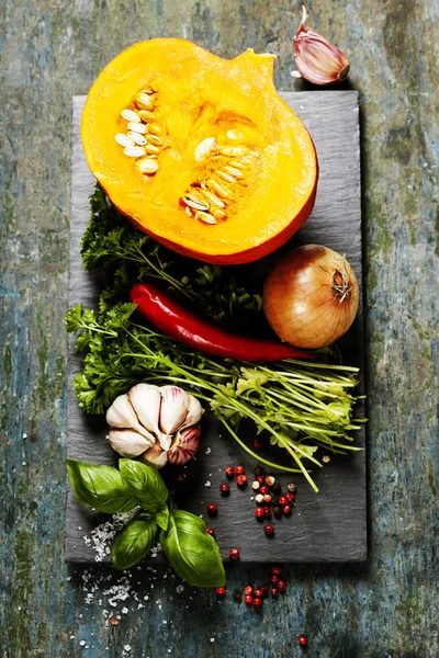 Pumpkin soup ingredients on wooden background — Stock Photo, Image